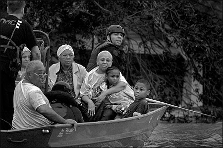 Families floating away from their flooding homes